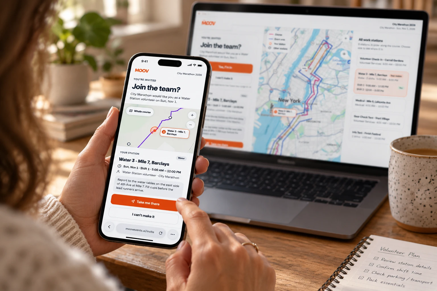 A volunteer's invite to City Marathon open on a phone and a laptop: Join the team, their water station and the course map